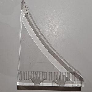 Lucite hands playing piano